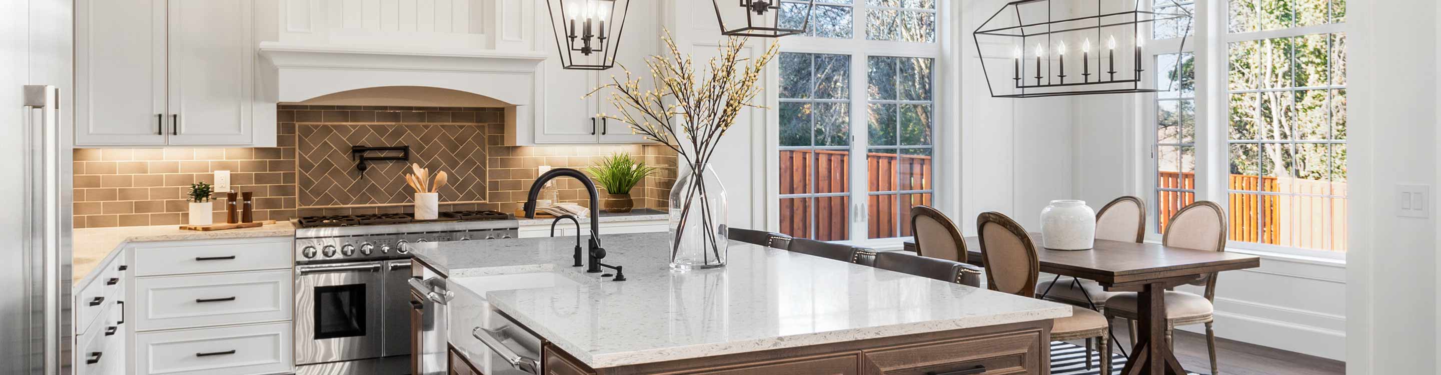 modern farmhouse kitchen with white cabinets and white countertops